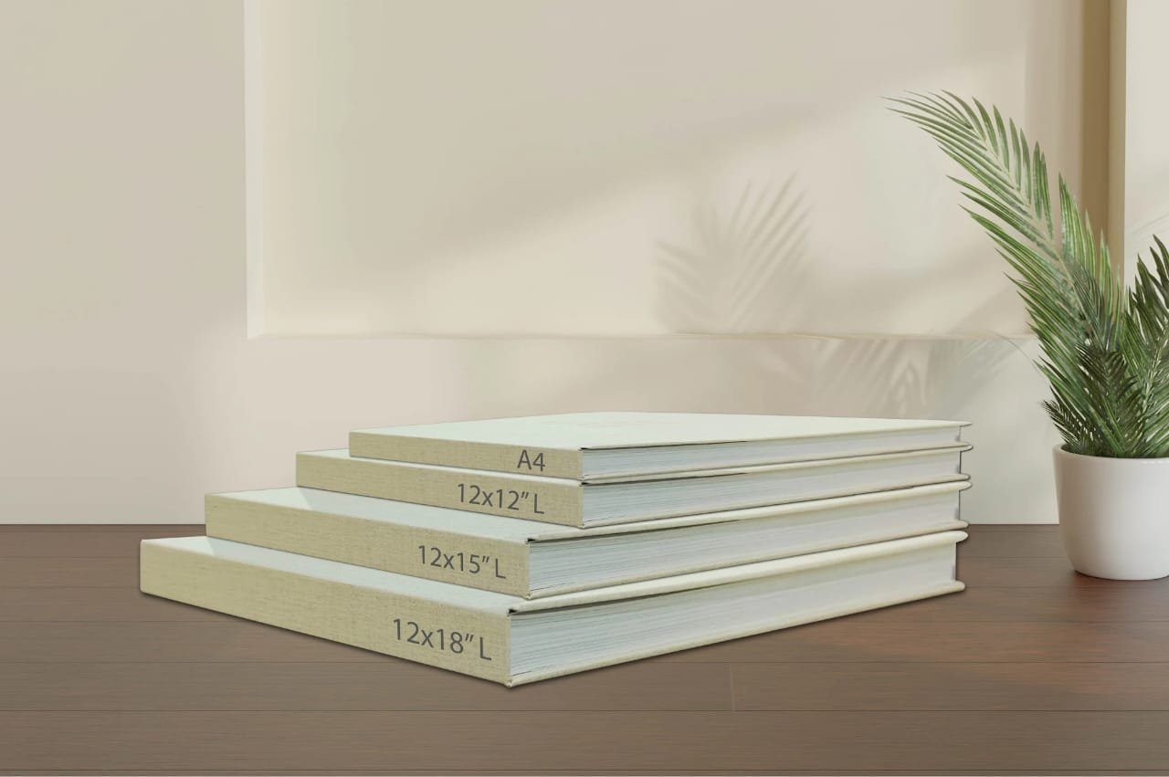 Stack of premium custom layflat treasure albums handcrafted by CraftedMemories Central Texas
