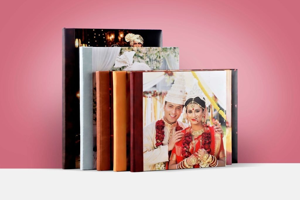 Display of various Crafted Memories custom photo books and classic velvet albums