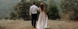 Wedding couple walking image from the back 