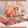 Custom wedding photo album with premium lay-flat binding, featuring a beautifully designed Indian wedding cover in a handcrafted presentation style