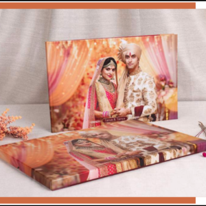 Custom wedding photo album with premium lay-flat binding, featuring a beautifully designed Indian wedding cover in a handcrafted presentation style