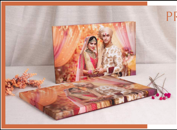 Custom wedding photo album with premium lay-flat binding, featuring a beautifully designed Indian wedding cover in a handcrafted presentation style