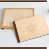 Rustic wooden photo album with natural wood cover and engraved personalization, displayed with a matching handcrafted presentation box
