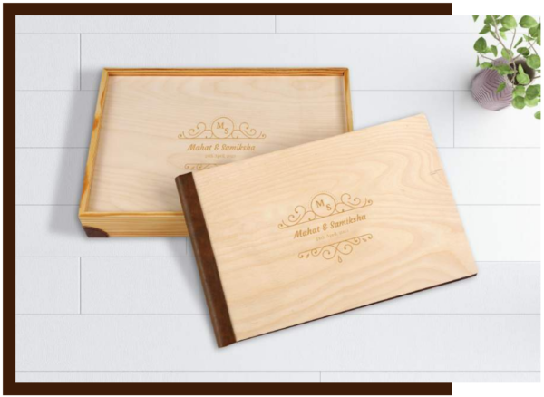 Rustic wooden photo album with natural wood cover and engraved personalization, displayed with a matching handcrafted presentation box