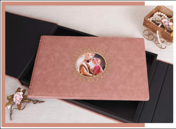 Luxury faux leather photo album with a soft blush cover and decorative picture window, featuring a personalized wedding photo centerpiece